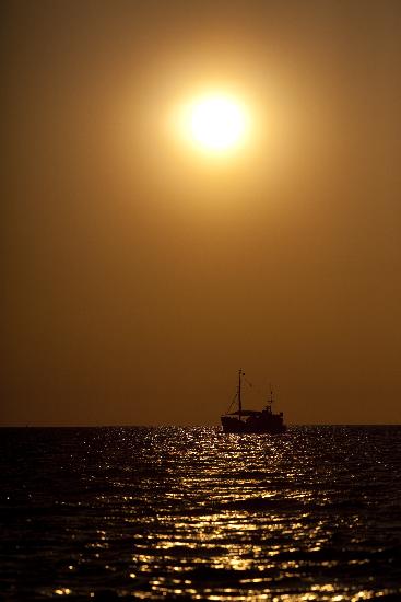 Segelboot bei Sonnenuntergang in Warnemünde from Arno Burgi