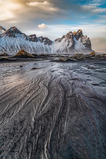 Low tide, black sand