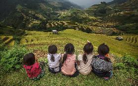 Children of Vietnam Sitting in the backyard The mountain in Mu Cang Chai,Yenbai,Vietnam.