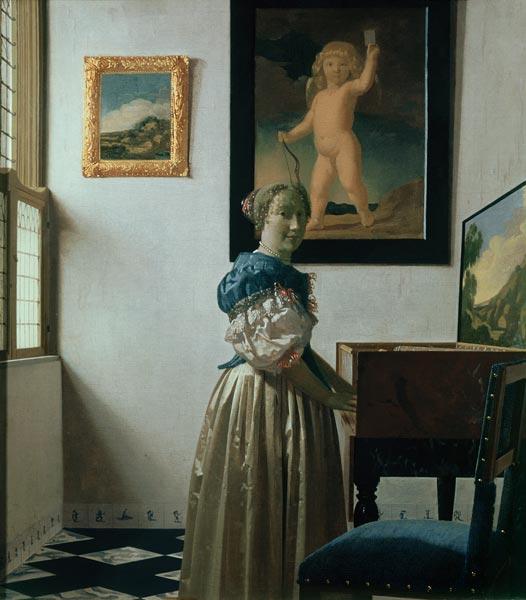Vermeer/Woman standing a.virginal/c.1672