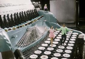 Couple dancing on the key of a giant typewriter, keys are leg of dancers, musical, 30's colourized d